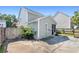 Backyard view of detached garage and adjacent home, showcasing outdoor space at 578 Delafield Dr, Summerville, SC 29483