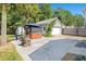 Backyard with a hot tub under an umbrella near the detached garage at 578 Delafield Dr, Summerville, SC 29483