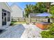 Outdoor patio with a hot tub, fire pit, and a view of the home and garage at 578 Delafield Dr, Summerville, SC 29483