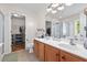 Bathroom features a double vanity with framed mirror, toilet, walk-in closet, and combination tub and shower at 578 Delafield Dr, Summerville, SC 29483