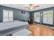 A primary bedroom featuring a ceiling fan, window with shutters, and a dedicated workspace at 578 Delafield Dr, Summerville, SC 29483