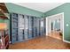 Another view of the unique bedroom showing hardwood floors and floor to ceiling shelving at 578 Delafield Dr, Summerville, SC 29483