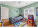 This bedroom features a window with wooden shutters, light green walls, and a Sonic the Hedgehog themed decor at 578 Delafield Dr, Summerville, SC 29483