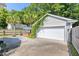 Detached garage with a hot tub on a brick patio near the driveway at 578 Delafield Dr, Summerville, SC 29483
