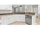 Bright eat-in kitchen features granite countertops, stainless steel appliances, white cabinets, and a tile floor at 578 Delafield Dr, Summerville, SC 29483
