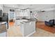 Bright eat-in kitchen featuring stainless steel appliances, granite countertops, white cabinets, and a tile floor at 578 Delafield Dr, Summerville, SC 29483