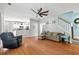 Spacious living room with hardwood floors, plush seating, ceiling fan and easy access to the kitchen at 578 Delafield Dr, Summerville, SC 29483