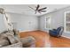 Inviting living room with hardwood floors, gray walls, ceiling fan and comfortable furniture at 578 Delafield Dr, Summerville, SC 29483