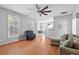 Cozy living room boasts hardwood floors, comfortable seating, ceiling fan and an inviting atmosphere at 578 Delafield Dr, Summerville, SC 29483