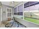 Charming screened-in porch with cozy rug and a view of the lush backyard at 578 Delafield Dr, Summerville, SC 29483