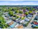 Bird's-eye view of a residential area with lush greenery, showcasing charming homes and tree-lined streets at 6 Dewey St, Charleston, SC 29403