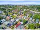 Expansive aerial view of a diverse neighborhood featuring a mix of homes, green spaces and downtown views at 6 Dewey St, Charleston, SC 29403