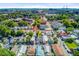 Bright aerial view of a neighborhood with mature trees and views of the city skyline and bridge at 6 Dewey St, Charleston, SC 29403