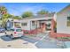 Charming single-story home featuring a brick and white facade with a convenient covered parking area at 6 Dewey St, Charleston, SC 29403