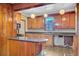 Kitchen featuring bar area, wooden cabinetry, and a window at 6 Dewey St, Charleston, SC 29403