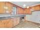 The kitchen has lots of cabinet space, double sinks, and a window for natural light at 6 Dewey St, Charleston, SC 29403
