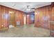 The living room has wood paneling and tile floors, offering a view into a different room at 6 Dewey St, Charleston, SC 29403