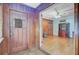 Living room featuring wood paneling, hardwood floors, a ceiling fan, and vintage furniture at 6 Dewey St, Charleston, SC 29403