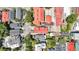 An aerial view showcases a vibrant neighborhood with tree-lined streets and colorful rooftops at 68 Vanderhorst St # A, Charleston, SC 29403