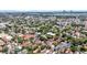 An aerial shot showcasing a city neighborhood with tree cover and the ocean in the background at 68 Vanderhorst St # A, Charleston, SC 29403
