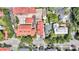 A charming neighborhood featuring red-roofed homes and lush green trees from an aerial view at 68 Vanderhorst St # A, Charleston, SC 29403