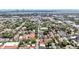 A scenic aerial view displays lush greenery, colorful houses, and a bridge in the distance at 68 Vanderhorst St # A, Charleston, SC 29403