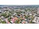 A sprawling cityscape featuring tree-lined streets and colorful houses, captured from above in summer at 68 Vanderhorst St # A, Charleston, SC 29403