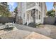 Backyard showcasing a spiral staircase and an outdoor dining area with comfortable seating at 68 Vanderhorst St # A, Charleston, SC 29403