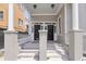 Inviting double doors with white columns and multiple steps leading up to the porch at 68 Vanderhorst St # A, Charleston, SC 29403