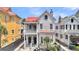 Classic home featuring a red roof, dual balconies, and symmetrical facade at 68 Vanderhorst St # A, Charleston, SC 29403