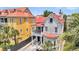 Two-story home boasts a red roof, classic architecture, and a cozy porch, blending charm with vibrant curb appeal at 68 Vanderhorst St # A, Charleston, SC 29403