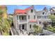 Charming two-story home with a red roof, double porches, and lush greenery at 68 Vanderhorst St # A, Charleston, SC 29403
