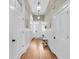 Bright hallway featuring hardwood floors and stylish lighting fixtures at 68 Vanderhorst St # A, Charleston, SC 29403