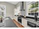 Well-equipped kitchen with stainless steel appliances and dark countertops at 68 Vanderhorst St # A, Charleston, SC 29403