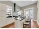 Modern kitchen with stainless appliances, black countertops, and light cabinetry at 68 Vanderhorst St # A, Charleston, SC 29403
