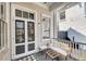 Charming porch with comfortable seating, perfect for relaxing outdoors at 68 Vanderhorst St # A, Charleston, SC 29403