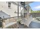 Relaxing porch with comfortable seating and a unique spiral staircase at 68 Vanderhorst St # A, Charleston, SC 29403