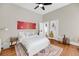 Bright bedroom with a ceiling fan, hardwood floors and neutral paint at 68 Vanderhorst St # B, Charleston, SC 29403