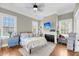 A bright bedroom with large windows and modern decor at 68 Vanderhorst St # B, Charleston, SC 29403