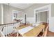 Elegant dining room with wood table, chair, and flooring adjacent to the kitchen and living area at 68 Vanderhorst St # B, Charleston, SC 29403