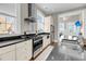 Bright and airy kitchen features sleek stainless steel appliances, granite countertops, and custom cabinets at 68 Vanderhorst St # B, Charleston, SC 29403
