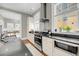 The spacious kitchen boasts stainless steel appliances, granite countertops, and ample natural light at 68 Vanderhorst St # B, Charleston, SC 29403