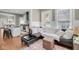 Spacious living room with hardwood floors, lots of natural light and open floor plan to kitchen at 68 Vanderhorst St # B, Charleston, SC 29403