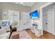 Cozy living room with french doors and television at 68 Vanderhorst St # B, Charleston, SC 29403