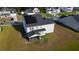 Aerial view of a two-story house with solar panels and screened in porch in a residential neighborhood at 6976 Pumpkinseed Dr, Johns Island, SC 29455