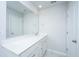 Modern bathroom featuring a single vanity, large mirror, and white cabinets with hardware at 6976 Pumpkinseed Dr, Johns Island, SC 29455