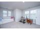 Versatile bedroom with a daybed, desk, treadmill, and plenty of natural light from multiple windows at 6976 Pumpkinseed Dr, Johns Island, SC 29455