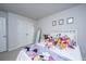 Spacious bedroom with a cozy bed, plush decor, and a closet at 6976 Pumpkinseed Dr, Johns Island, SC 29455