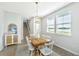 Charming dining room with seating for six and ample natural light from the windows at 6976 Pumpkinseed Dr, Johns Island, SC 29455