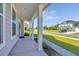 Inviting covered front porch with charming curb appeal in a Gathering-friendly neighborhood at 6976 Pumpkinseed Dr, Johns Island, SC 29455